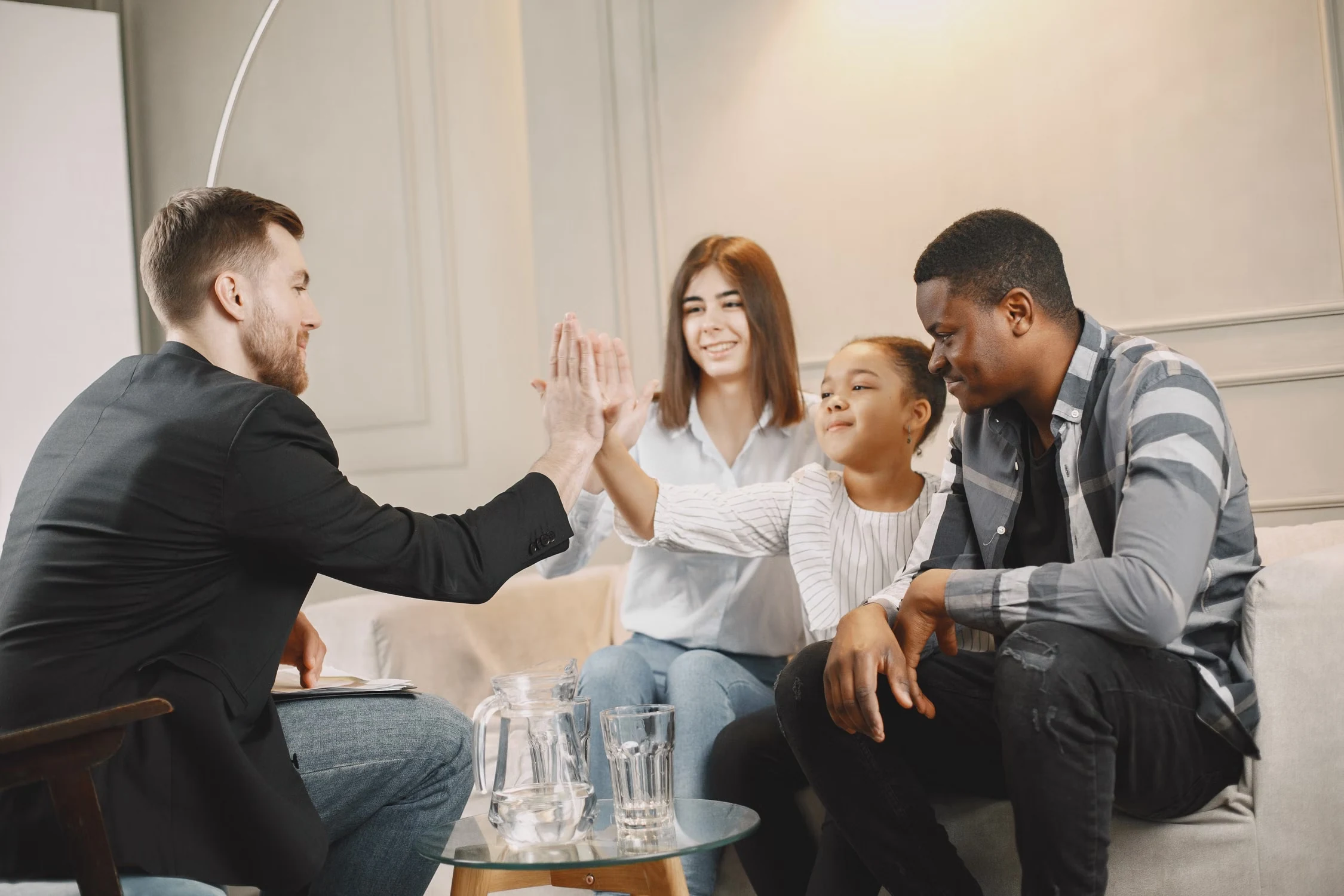A family meeting with a support professional in a welcoming room